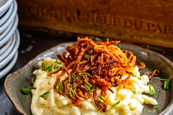 Käsespätzle topped with crispy fried onions