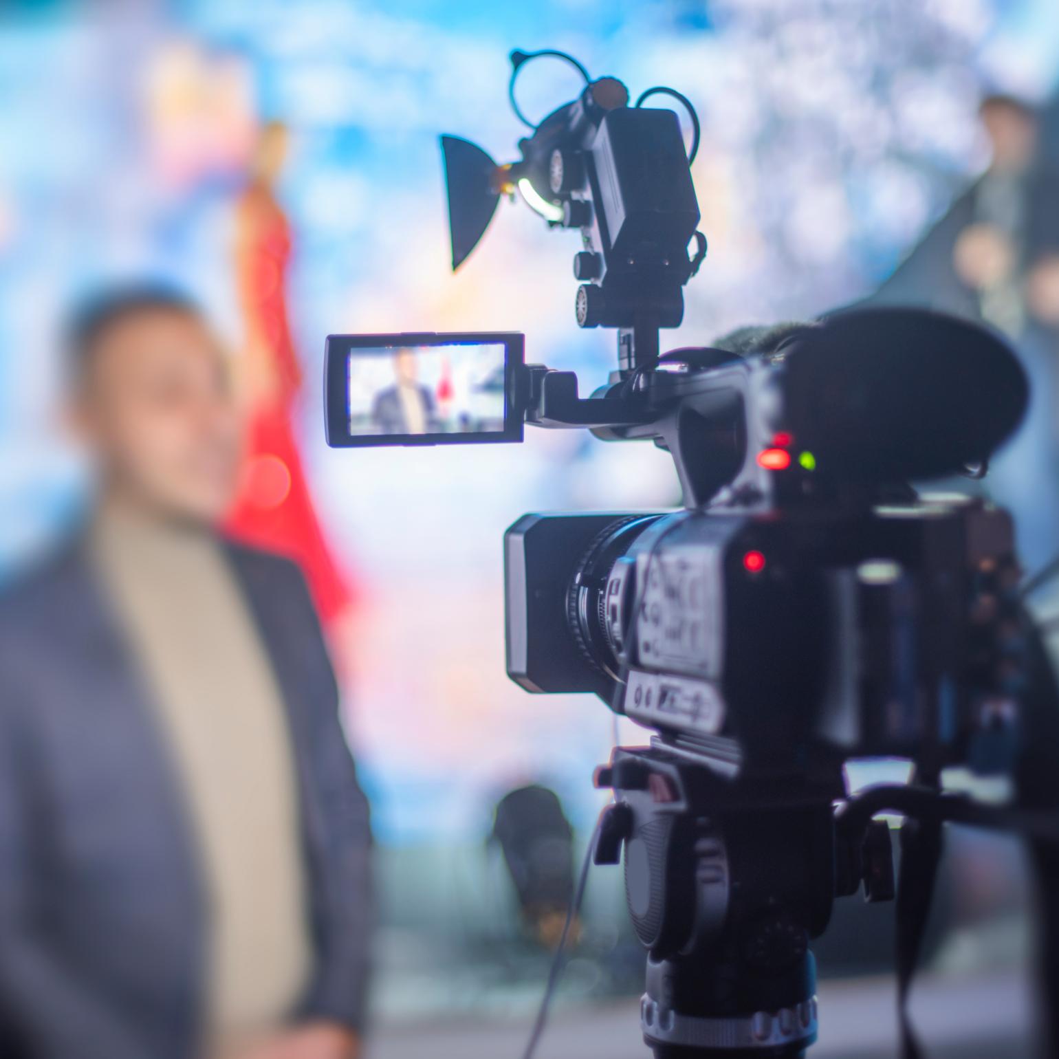 Behind the camera POV of reporter