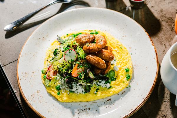 The Fireclay Omelet, made with charred tomato, mushrooms, spinach, cheddar, and Chef's potatoes