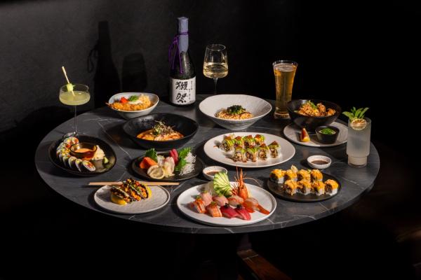 Group shot: nigiri, sashimi, rolls, skewers, sake, beer, cocktails