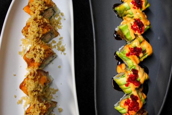 two sushi dishes on yin and yang plates