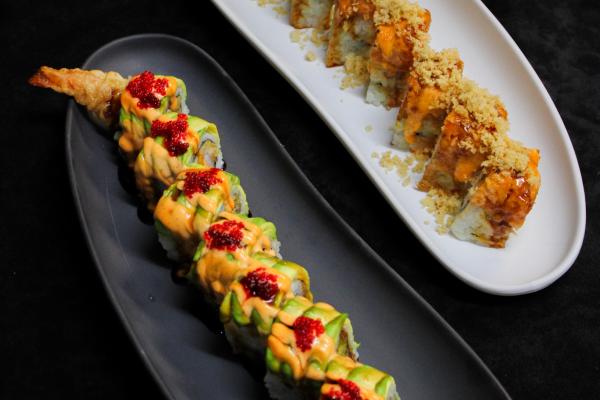 two sushi dishes on yin and yang plates