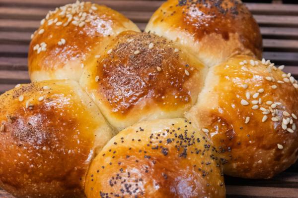 pull apart bread on an olive wood display