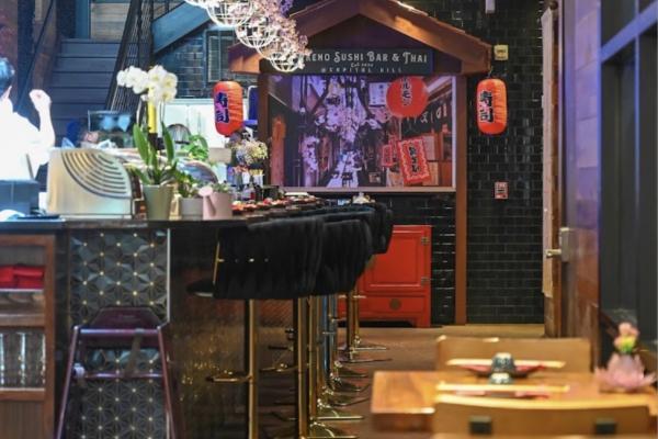 warm lighting, Japanese-inspired décor, and an inviting sushi bar that feels both vibrant and intimate