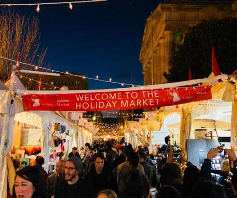 evening-shopping-at-the-downtown-holiday-market_ddc-photo.jpg
